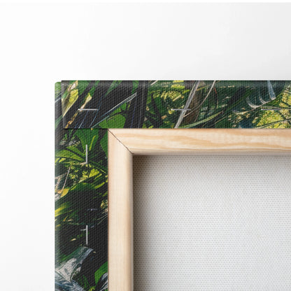 Tropical forest waterfall scene printed on stretched canvas with wooden frame edge, vibrant greens and natural tones.