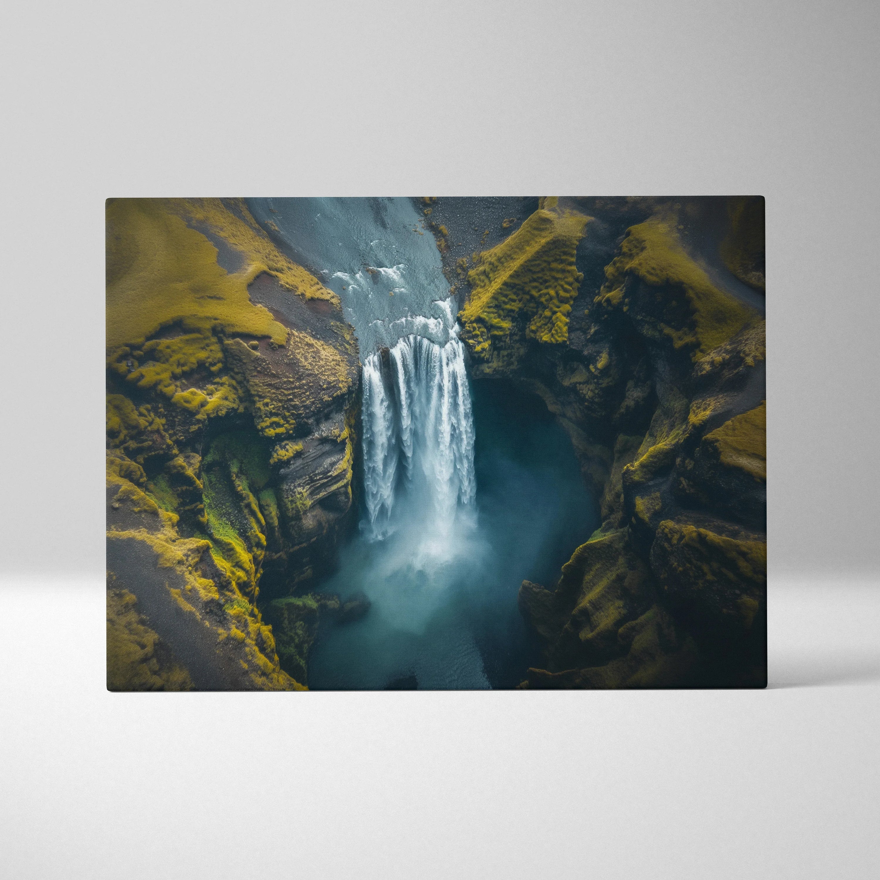 High-resolution canvas wall art featuring a misty Iceland waterfall surrounded by green moss and rugged cliffs.