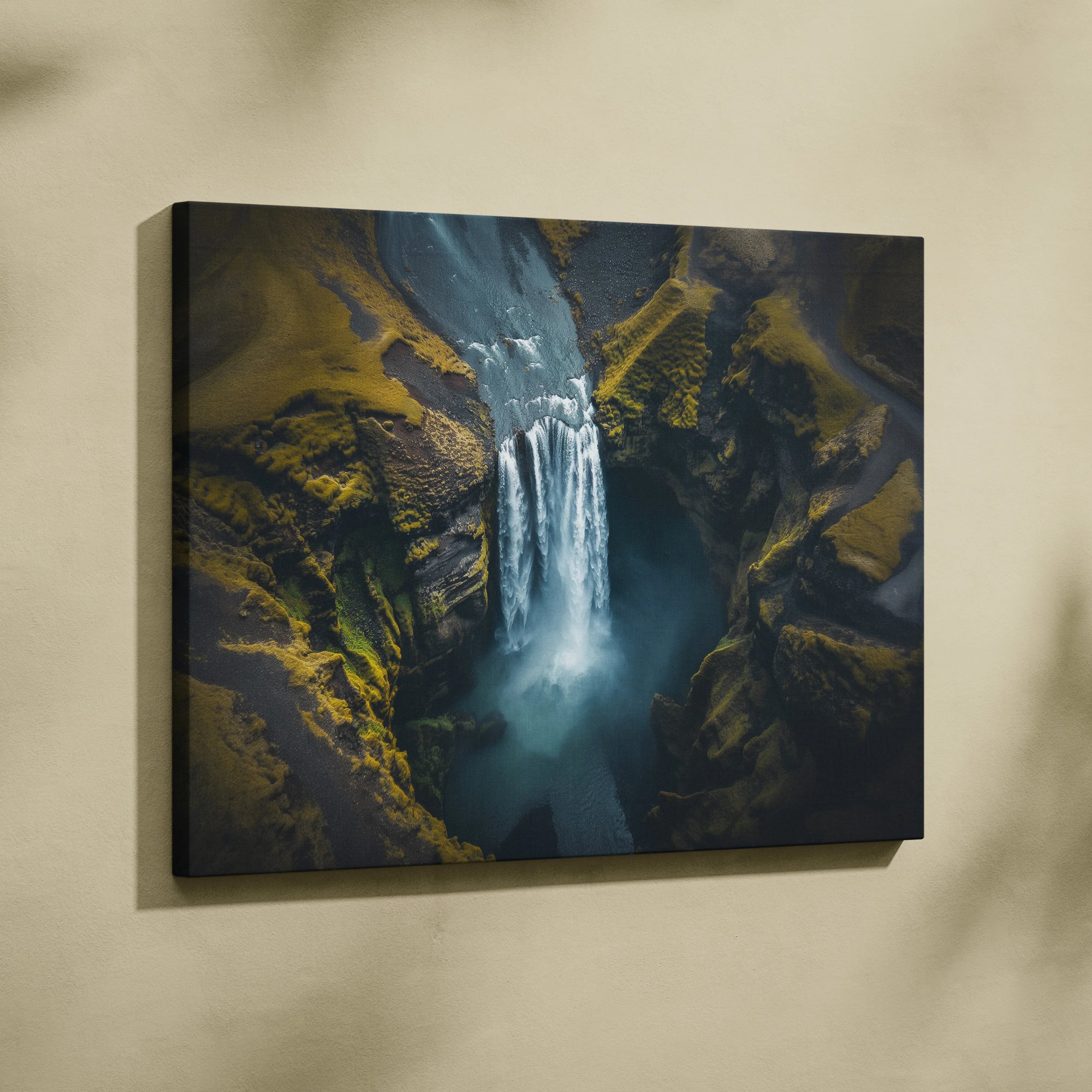 High-resolution canvas wall art of a cascading Iceland waterfall with mossy cliffs and misty water.