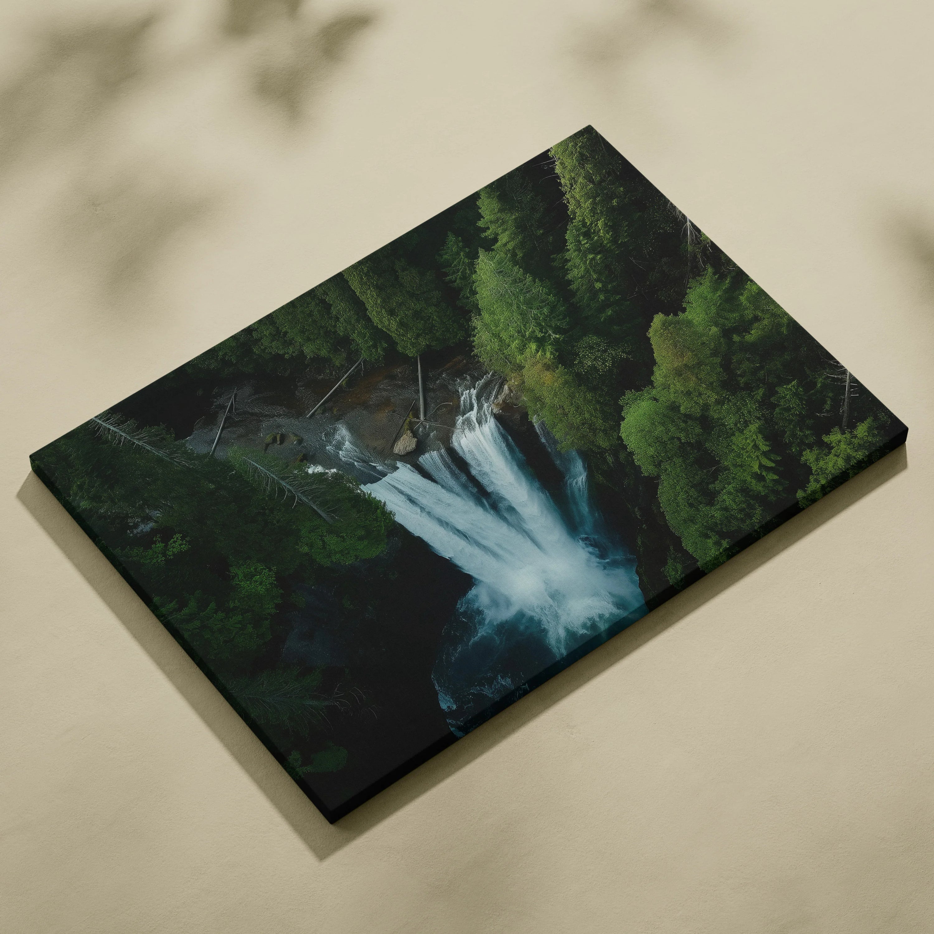 Aerial view canvas wall art featuring a vibrant forest waterfall with lush green trees and flowing water.