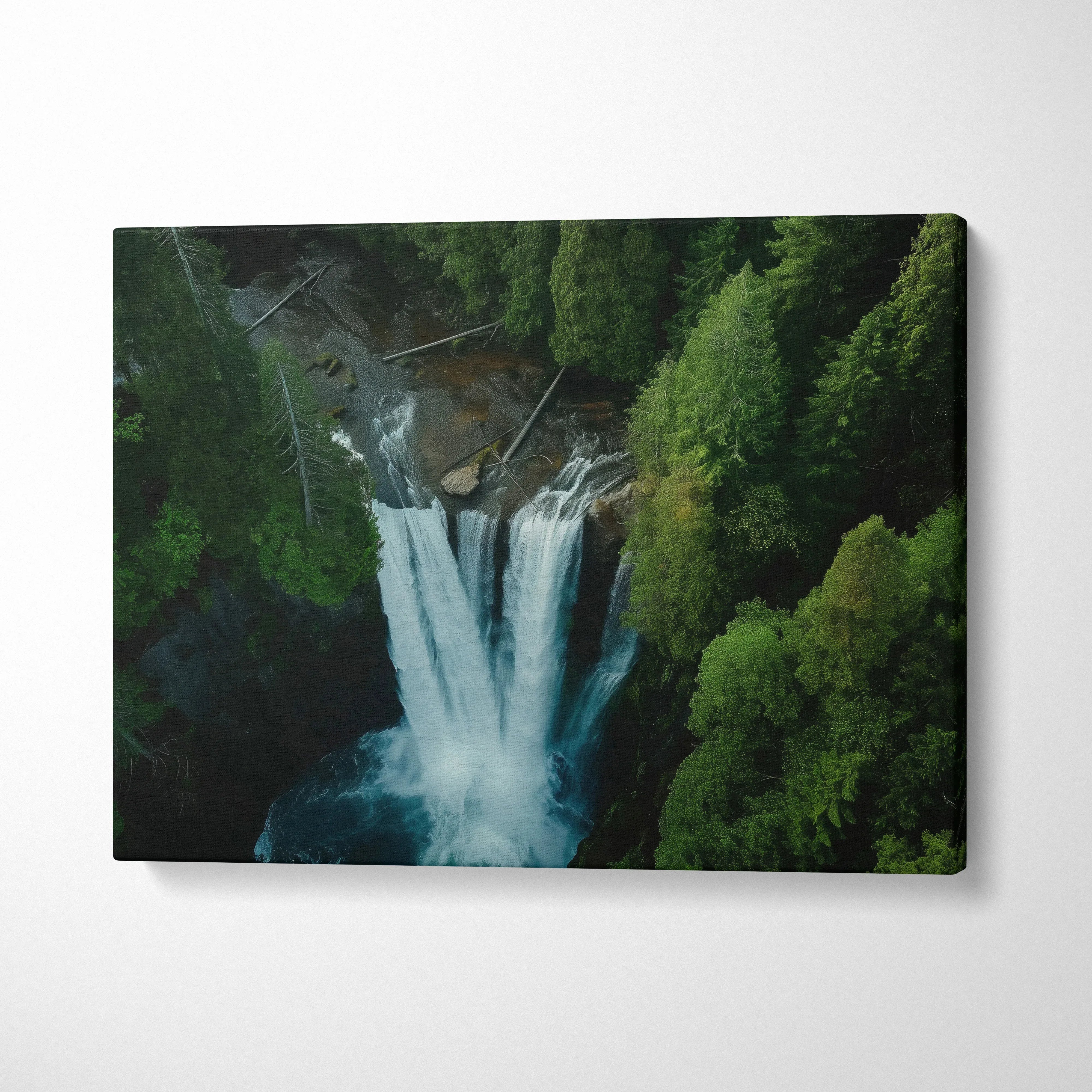 Aerial view canvas wall art of a waterfall surrounded by dense green forest decor.