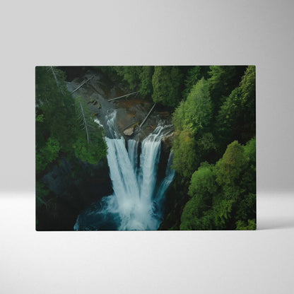 Aerial view canvas wall art of forest waterfall surrounded by lush green trees for nature decor.
