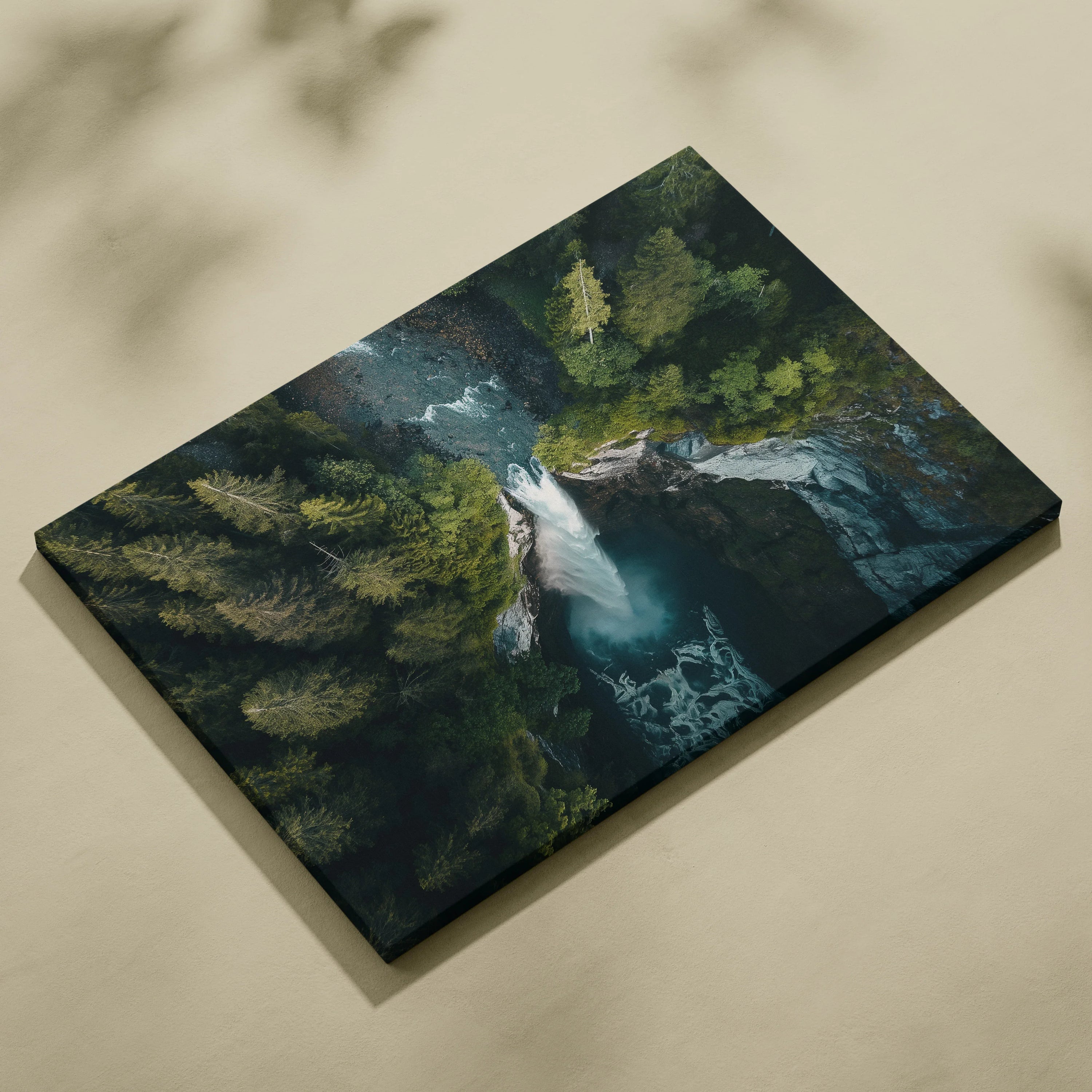 Canvas wall art depicting a vibrant forest landscape with a flowing waterfall and deep green trees.