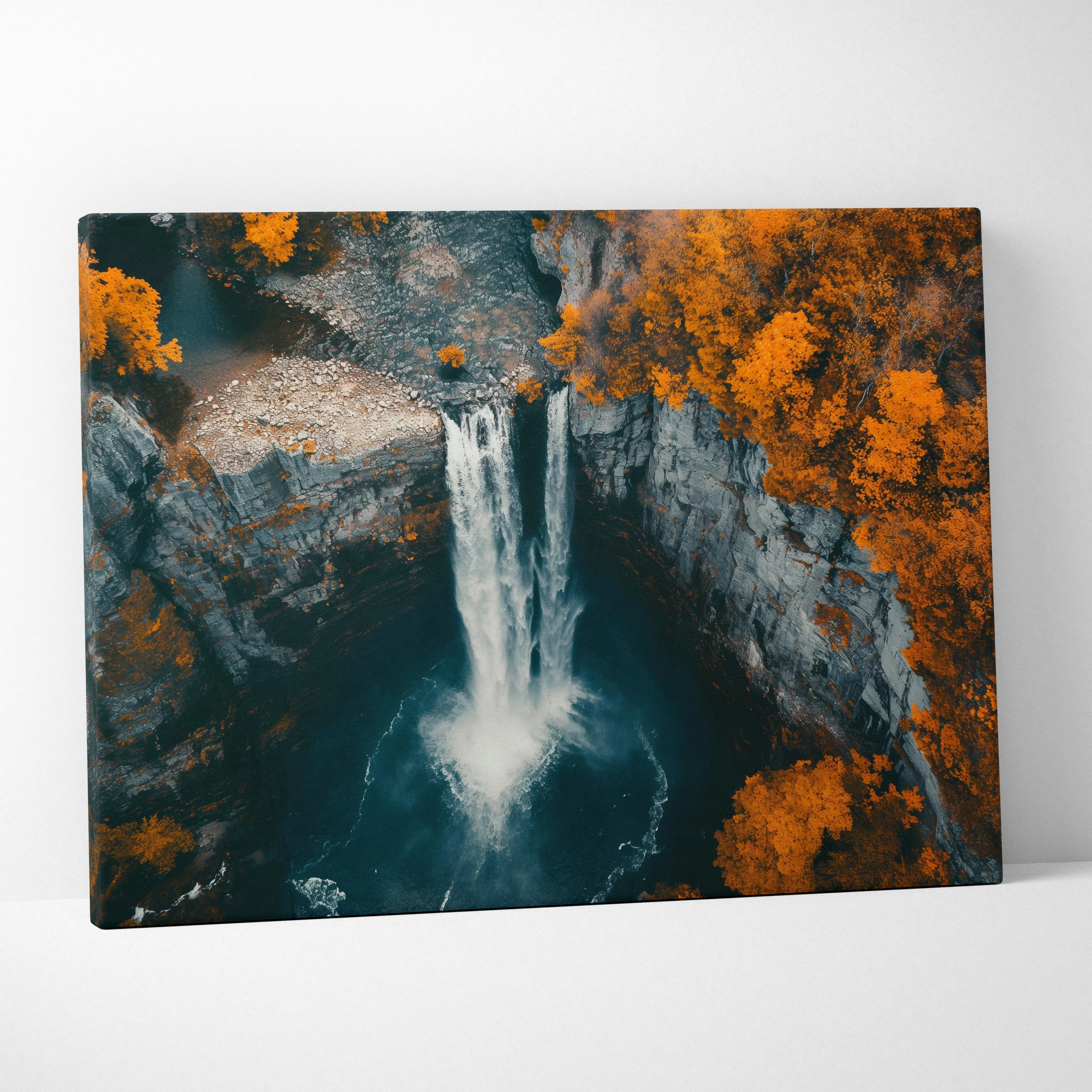 Canvas wall art featuring a vibrant forest waterfall with bright autumn orange foliage and rocky cliffs.