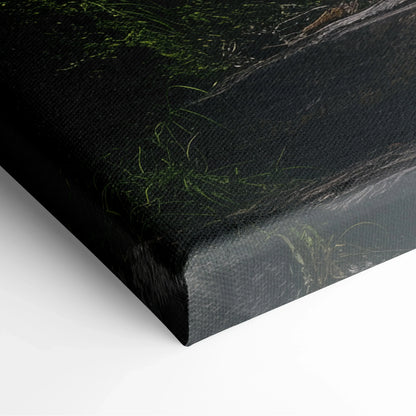 Close-up of canvas wall art corner showing textured edge with dark green forest and waterfall details on a smooth surface.