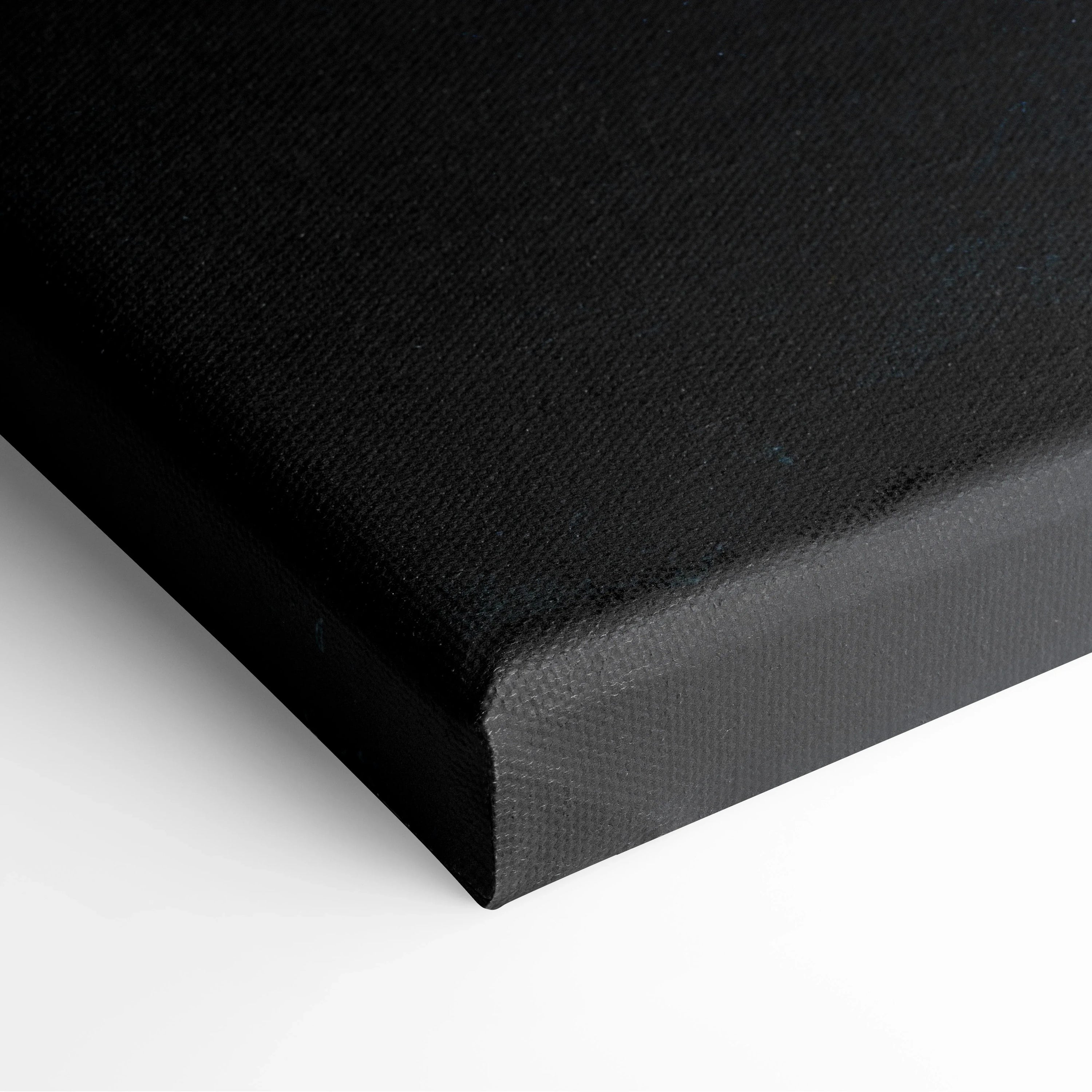 Black gallery-wrapped canvas with textured surface and neatly folded corner edges.