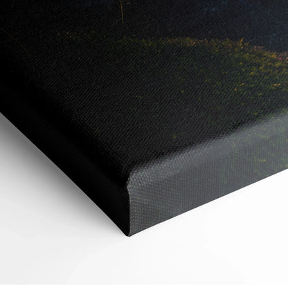 Corner detail of black canvas wall art with subtle green forest and waterfall decor texture.