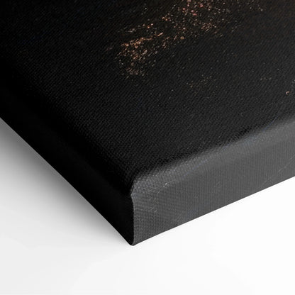 Close-up of black textured canvas corner with visible fabric weave and wrapped edge for wall art decor.