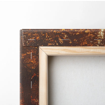 Close-up of a stretched canvas corner with autumn forest print and natural wood frame edges.