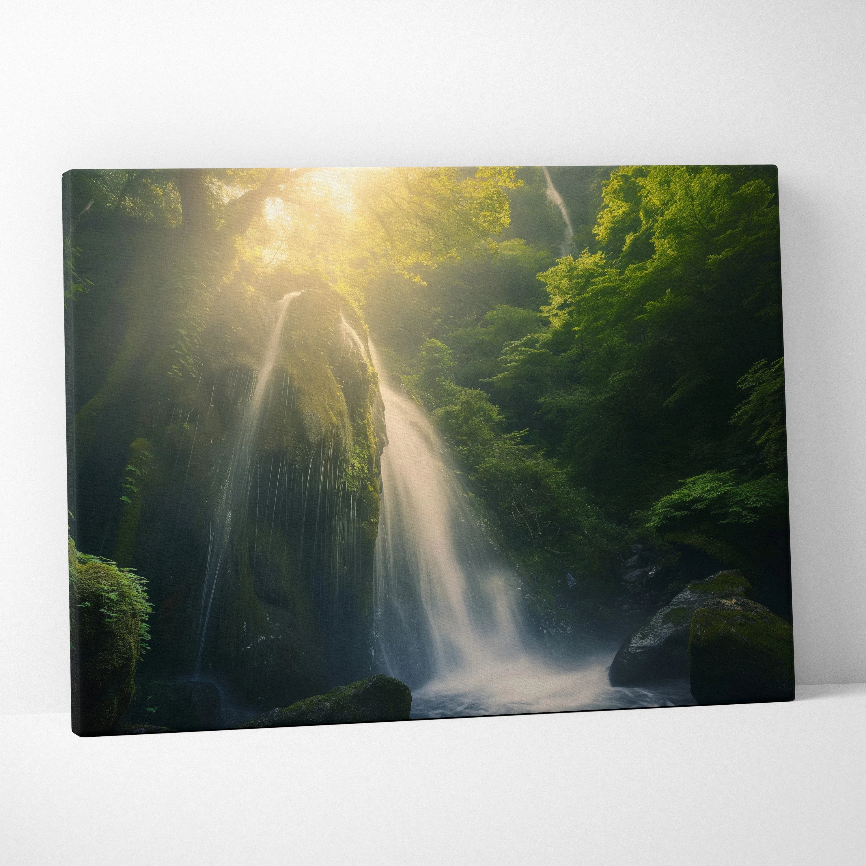 Canvas wall art depicting a serene waterfall cascading through lush moss-covered forest in soft sunlight.