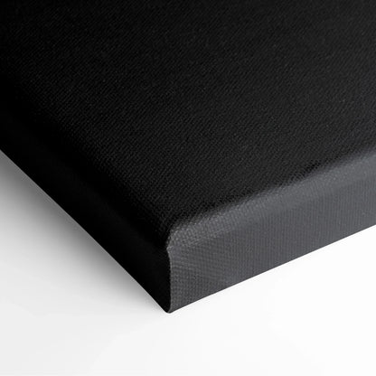 Black gallery-wrapped canvas with textured surface and sharp corner edges for wall art decor.