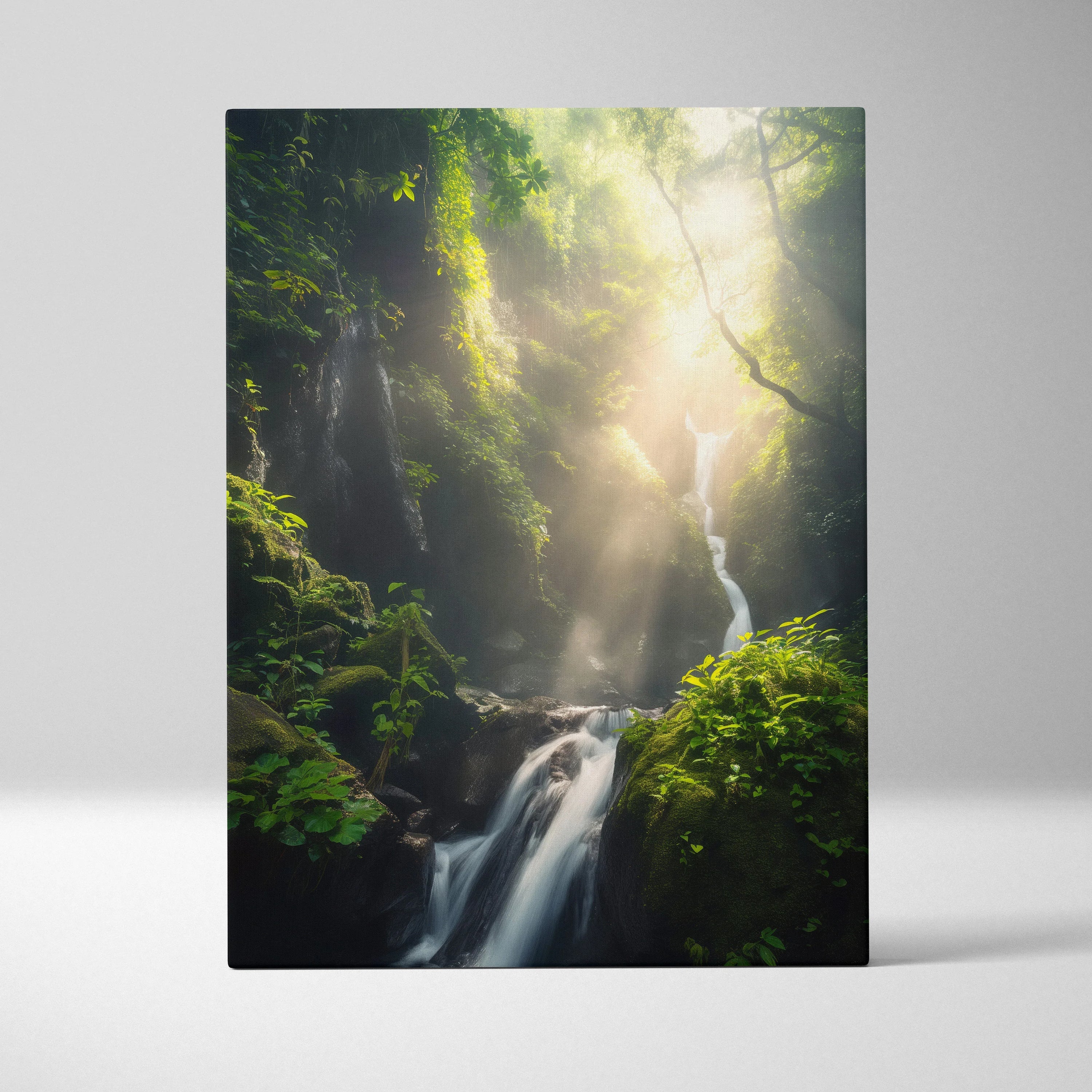 Vertical canvas wall art of a green forest waterfall with sun rays filtering through dense foliage, nature decor.