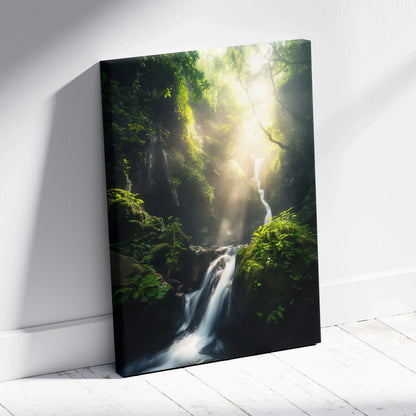 Vertical canvas wall art featuring a lush green forest with sunlight streaming through trees and a cascading waterfall.