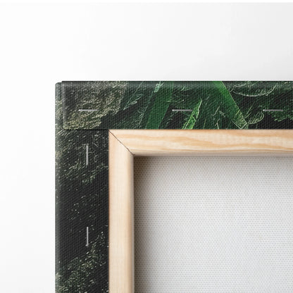 Close-up of stretched canvas wall art with natural wood frame and textured print of green nature scene.