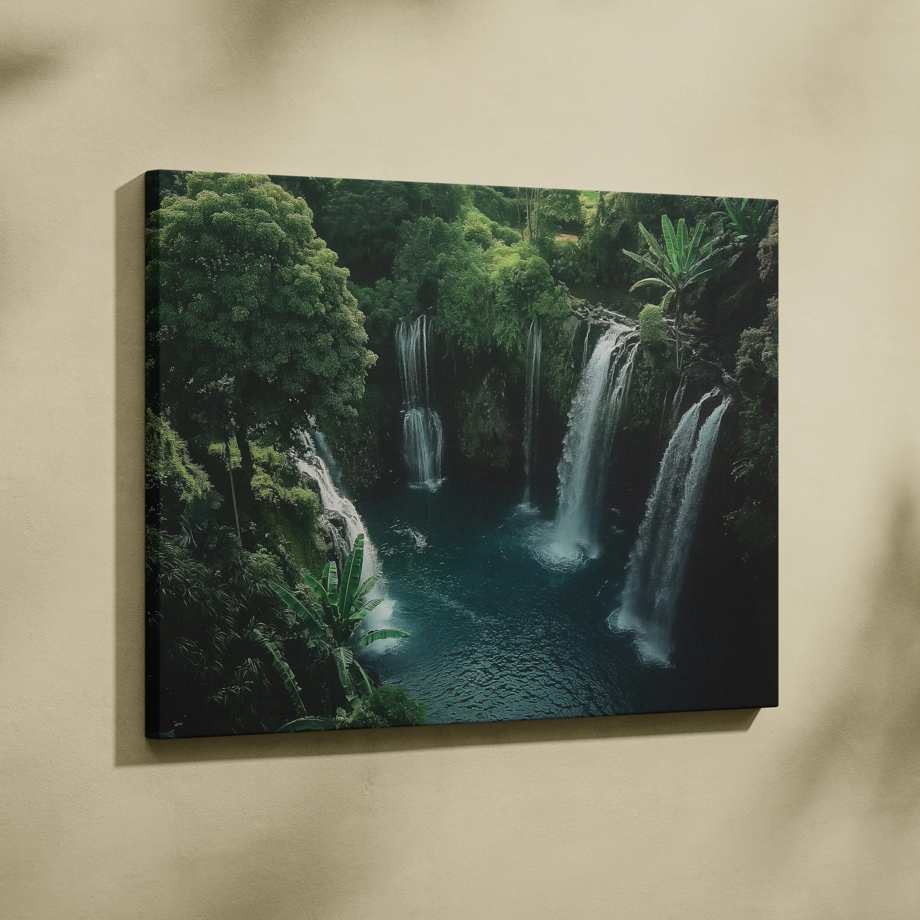 Canvas wall art featuring a vibrant turquoise pool beneath cascading waterfalls surrounded by lush green foliage.
