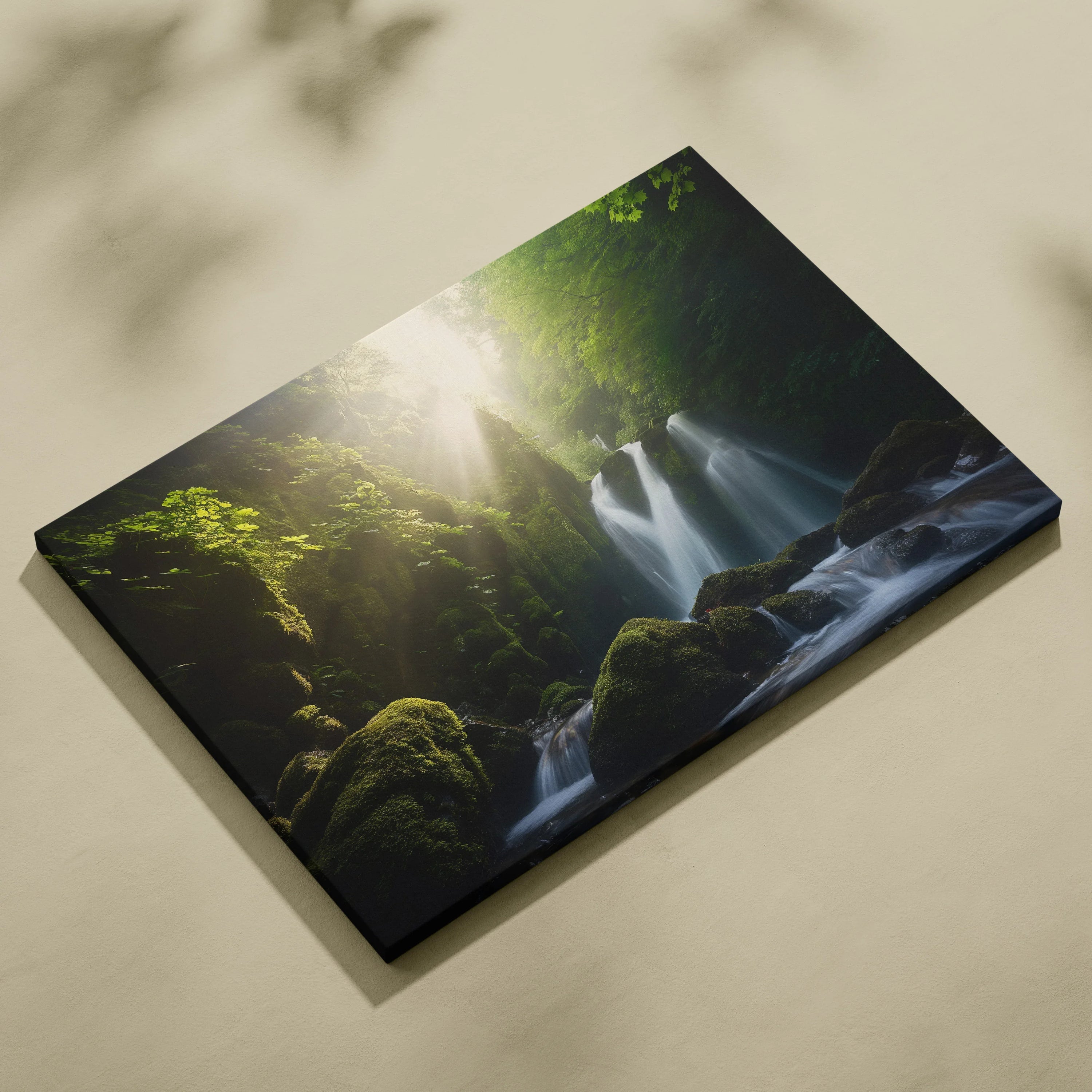 Canvas wall art depicting a lush green forest with a sunlit waterfall and moss-covered rocks.