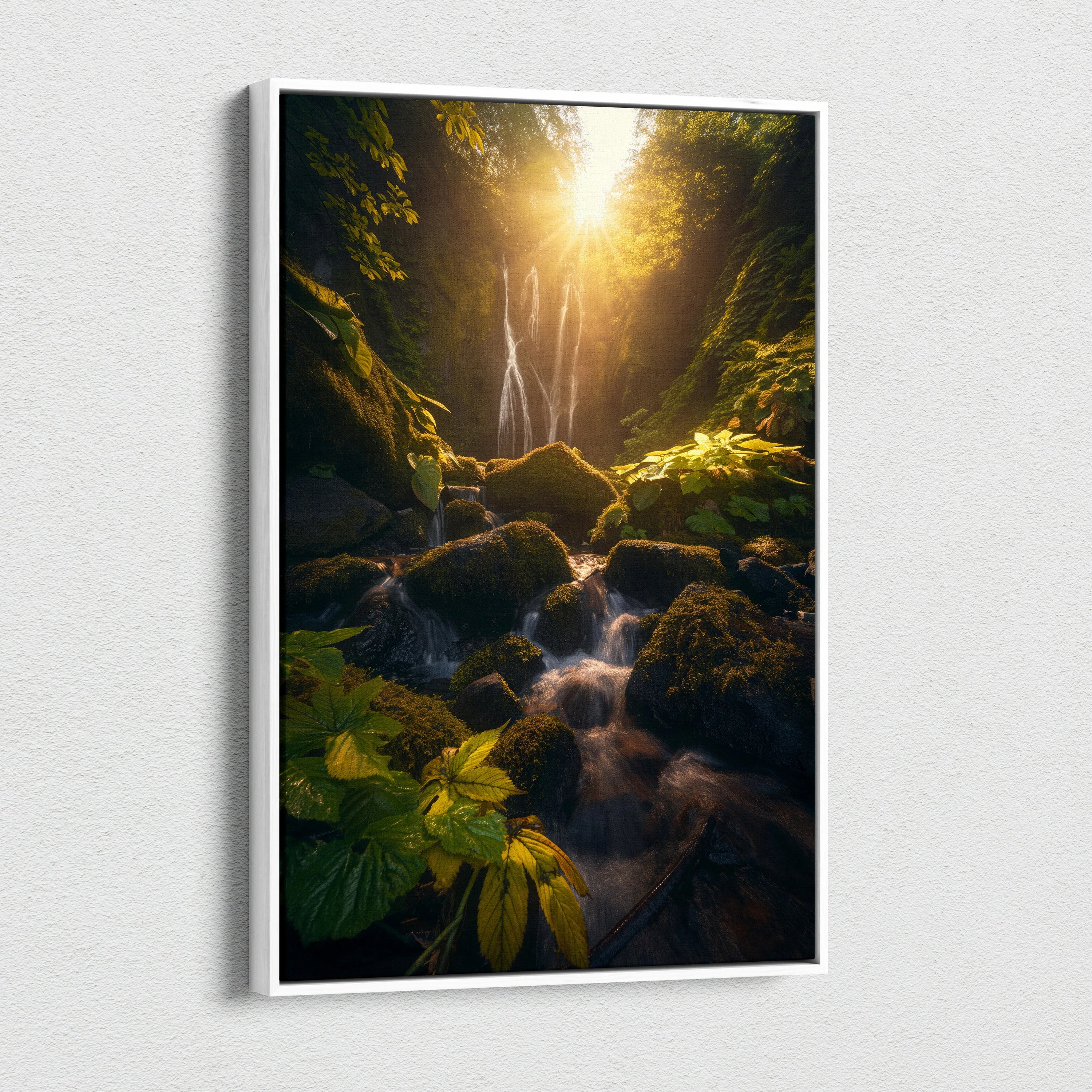 Canvas wall art featuring a lush green forest with a waterfall bathed in golden sunset light.