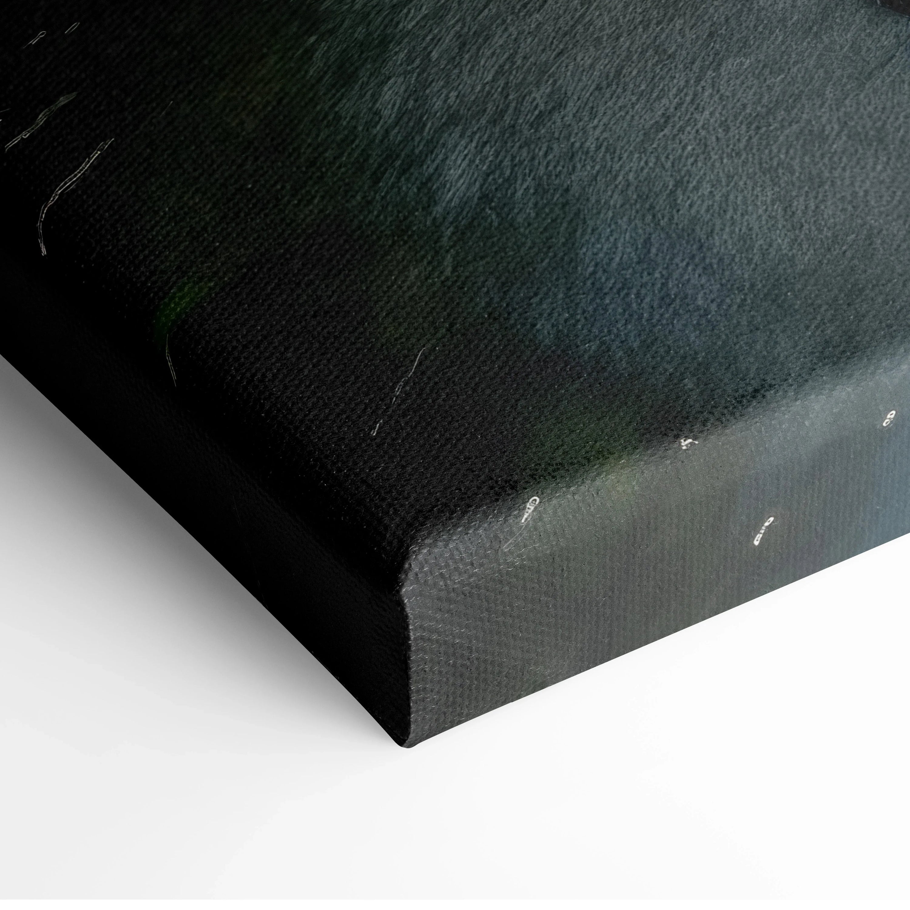 Close-up of textured canvas wall art featuring dark green hues and subtle hints of a forest and waterfall scene.