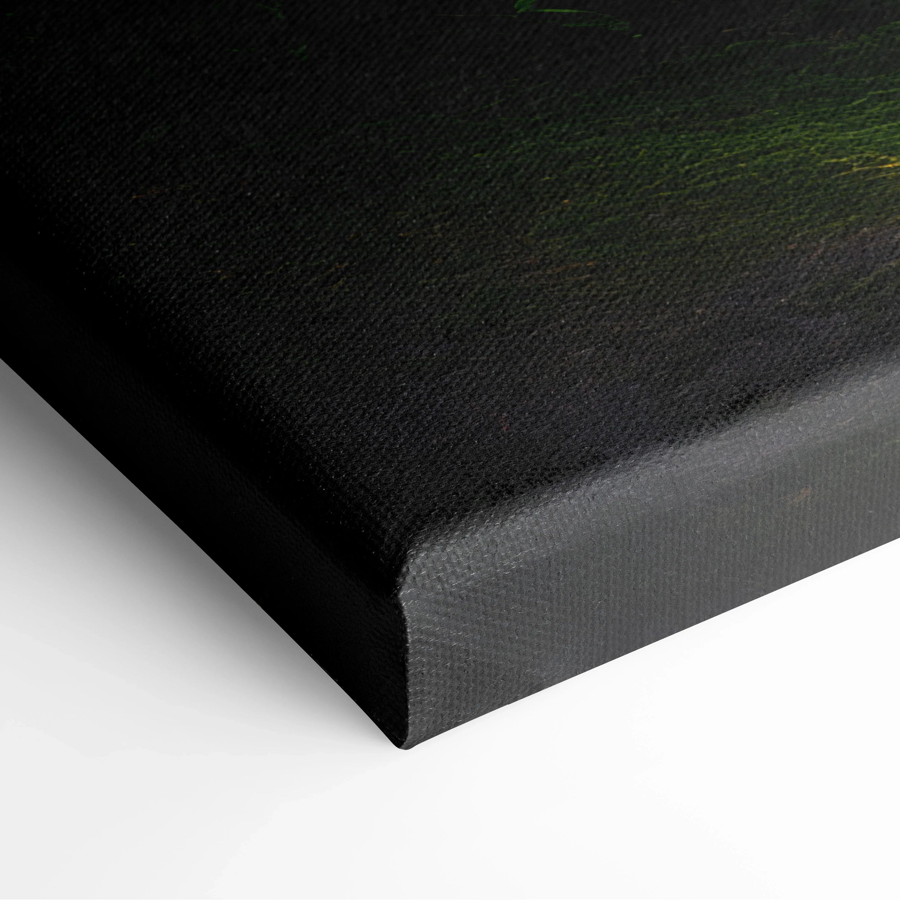 Close-up of black canvas wall art corner with textured surface and stretched edge.