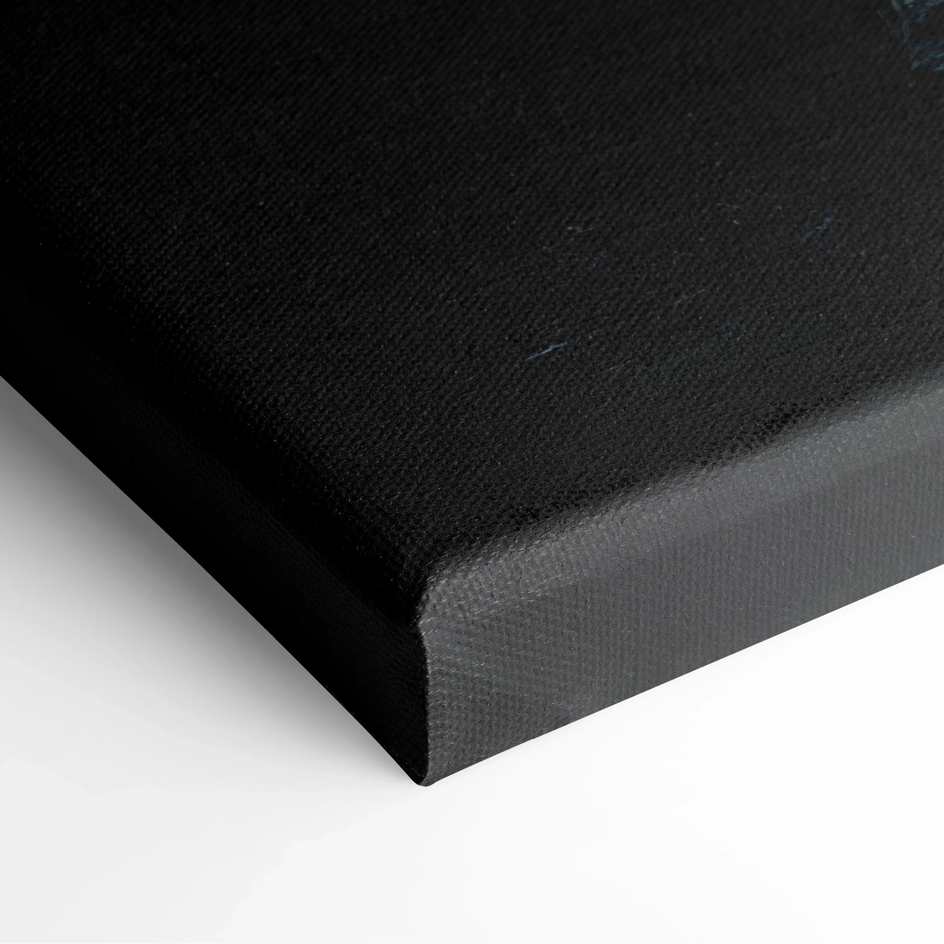 Close-up of a black canvas wrap with textured fabric and clean, sharp edges for wall art decor.