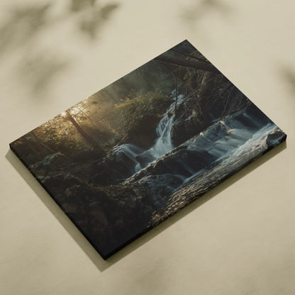 Waterfall forest nature canvas wall art with flowing water and sunlight in dark woodland decor.