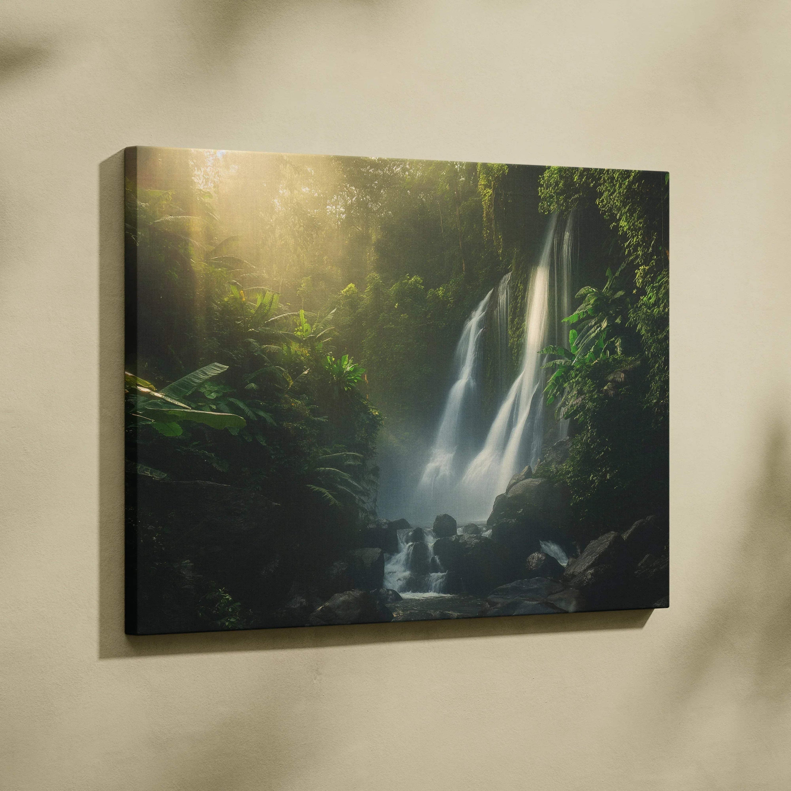 Waterfall in lush forest canvas wall art with soft sunlight, nature landscape decor.
