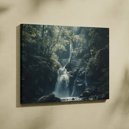 Waterfall in lush forest canvas wall art with rich green foliage and flowing water decor.
