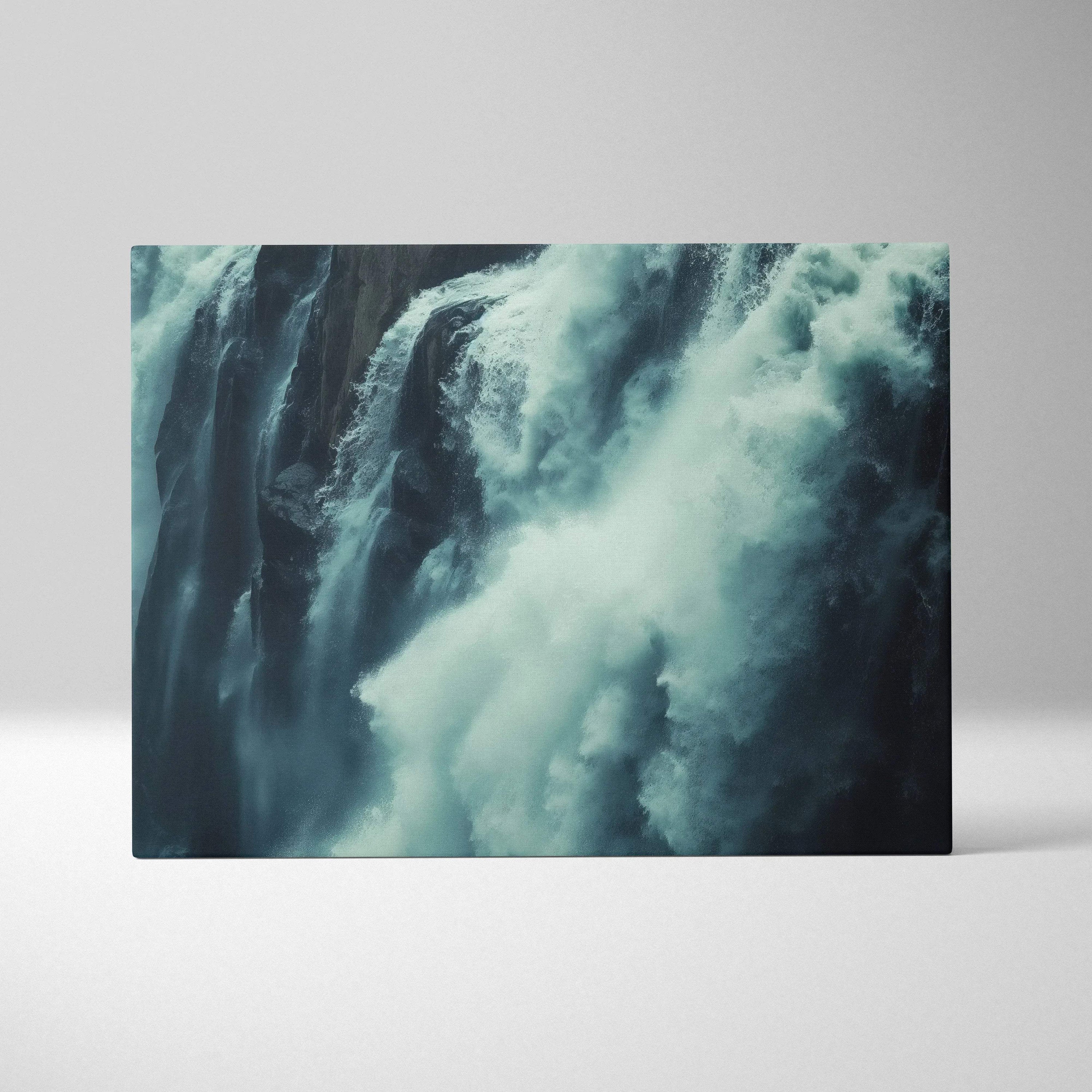 Close-up canvas wall art of a rushing waterfall in cool blue and white tones, high-resolution nature decor.