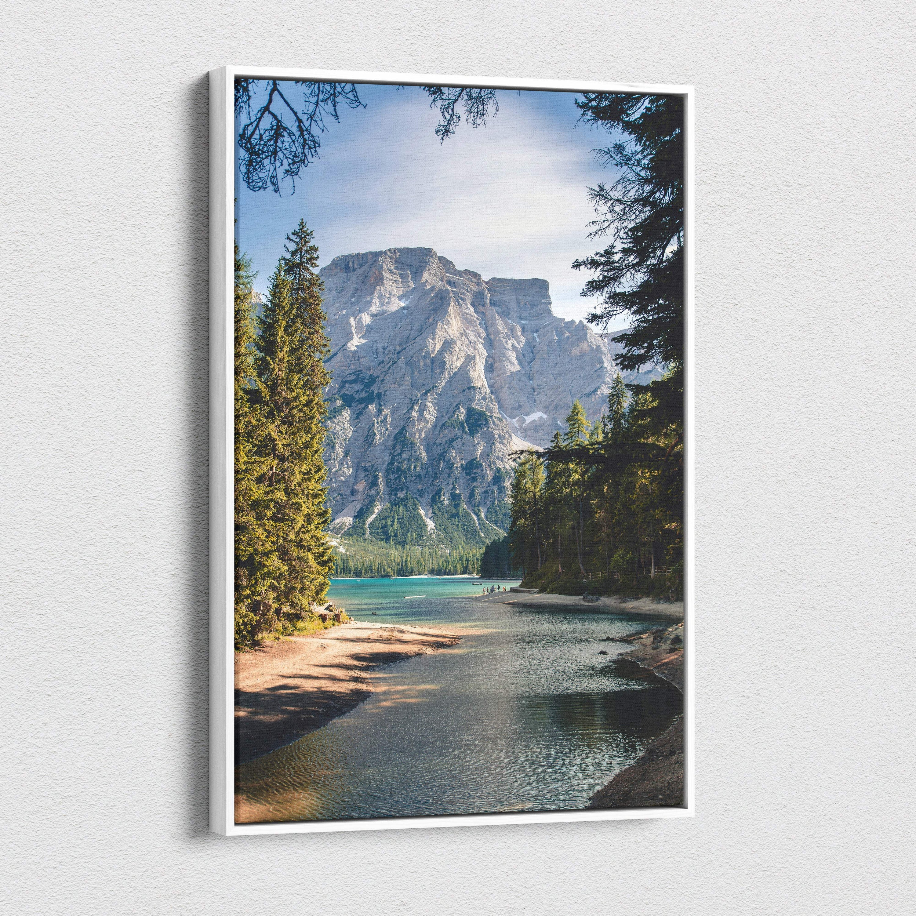 White-framed canvas wall art featuring a serene green blue mountain lake with alpine forest landscape decor