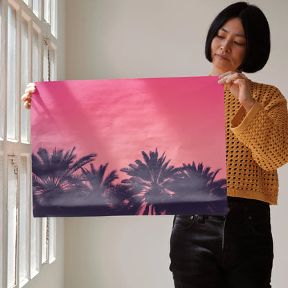 Pink and purple beach sunset poster with silhouetted palm trees wall art.