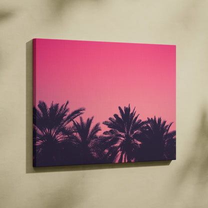 Canvas wall art featuring palm silhouettes against a vibrant pink sunset sky.