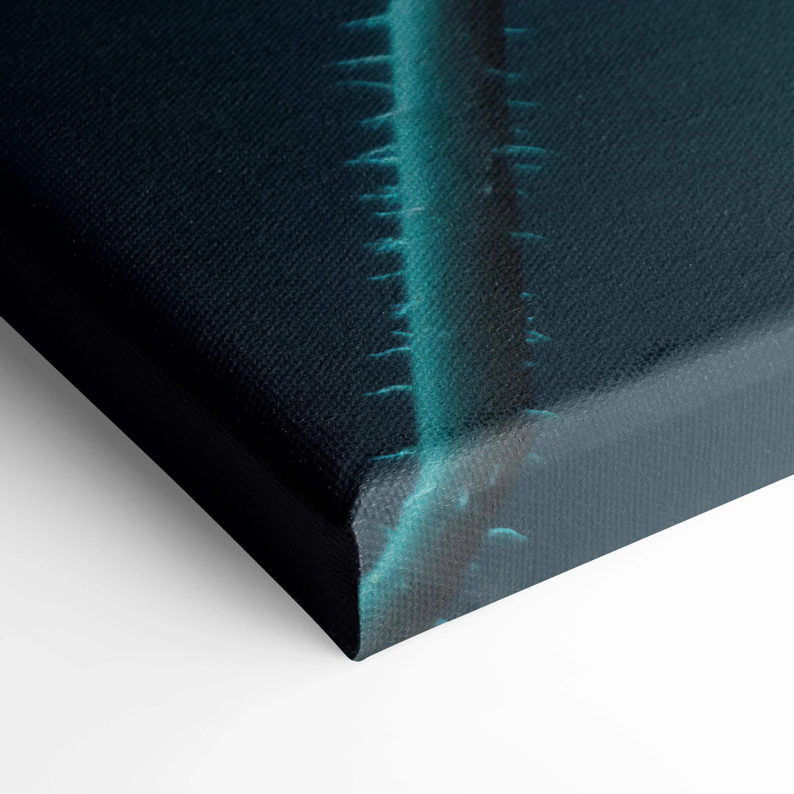 Close-up of vibrant floral canvas wall art with teal petals on a black background.