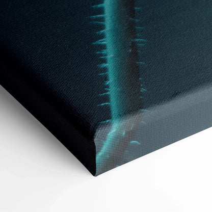 Close-up of vibrant floral canvas wall art with teal petals on a black background.
