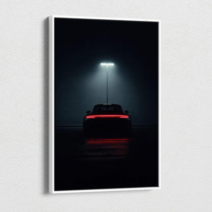 Vertical canvas wall art featuring a Porsche 911 rear view illuminated by streetlight in dark setting.