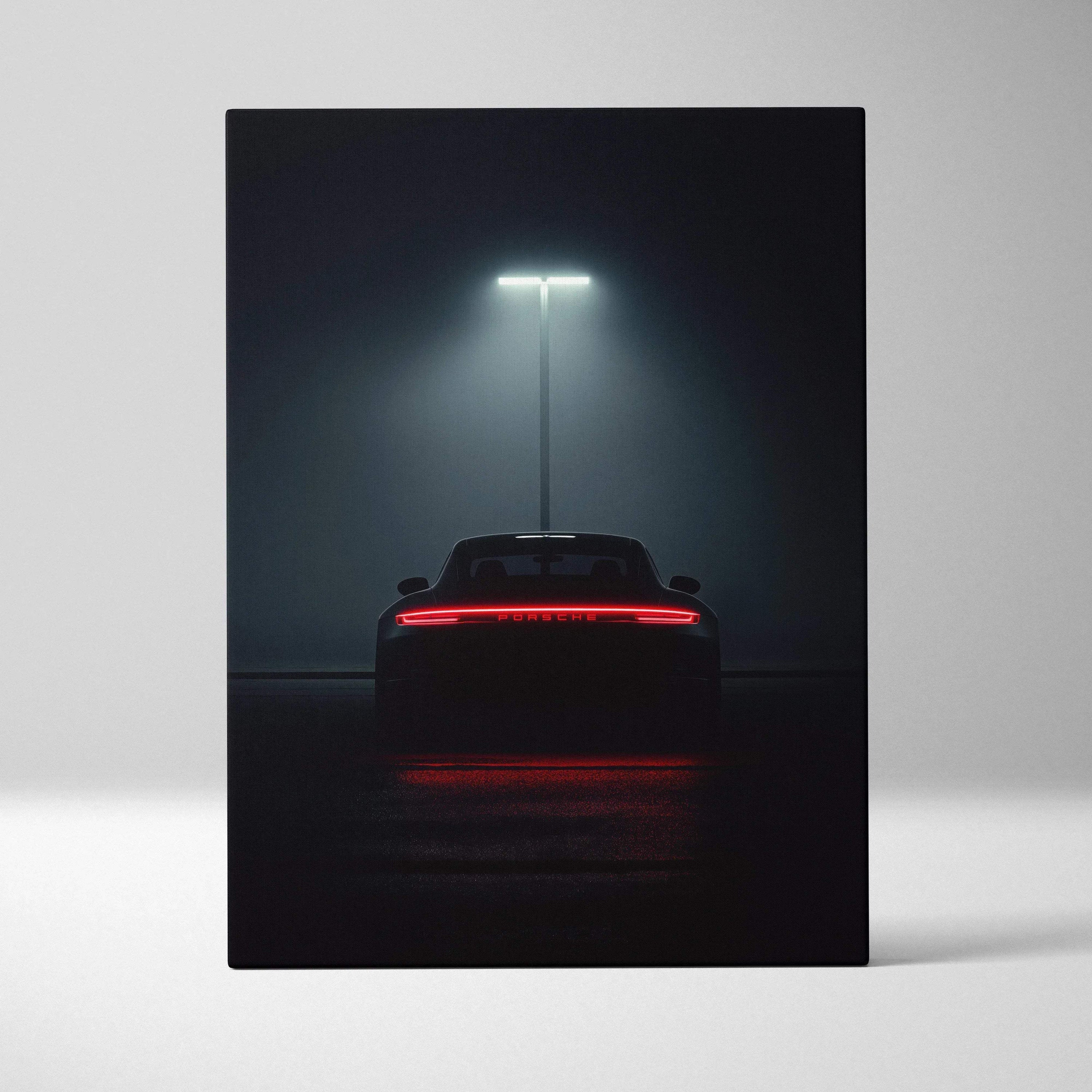Canvas wall art featuring rear view of sleek black Porsche sports car under spotlight.