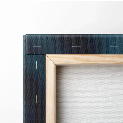 Close-up of wooden frame and black canvas edge with staples on autumn-themed wall art canvas.