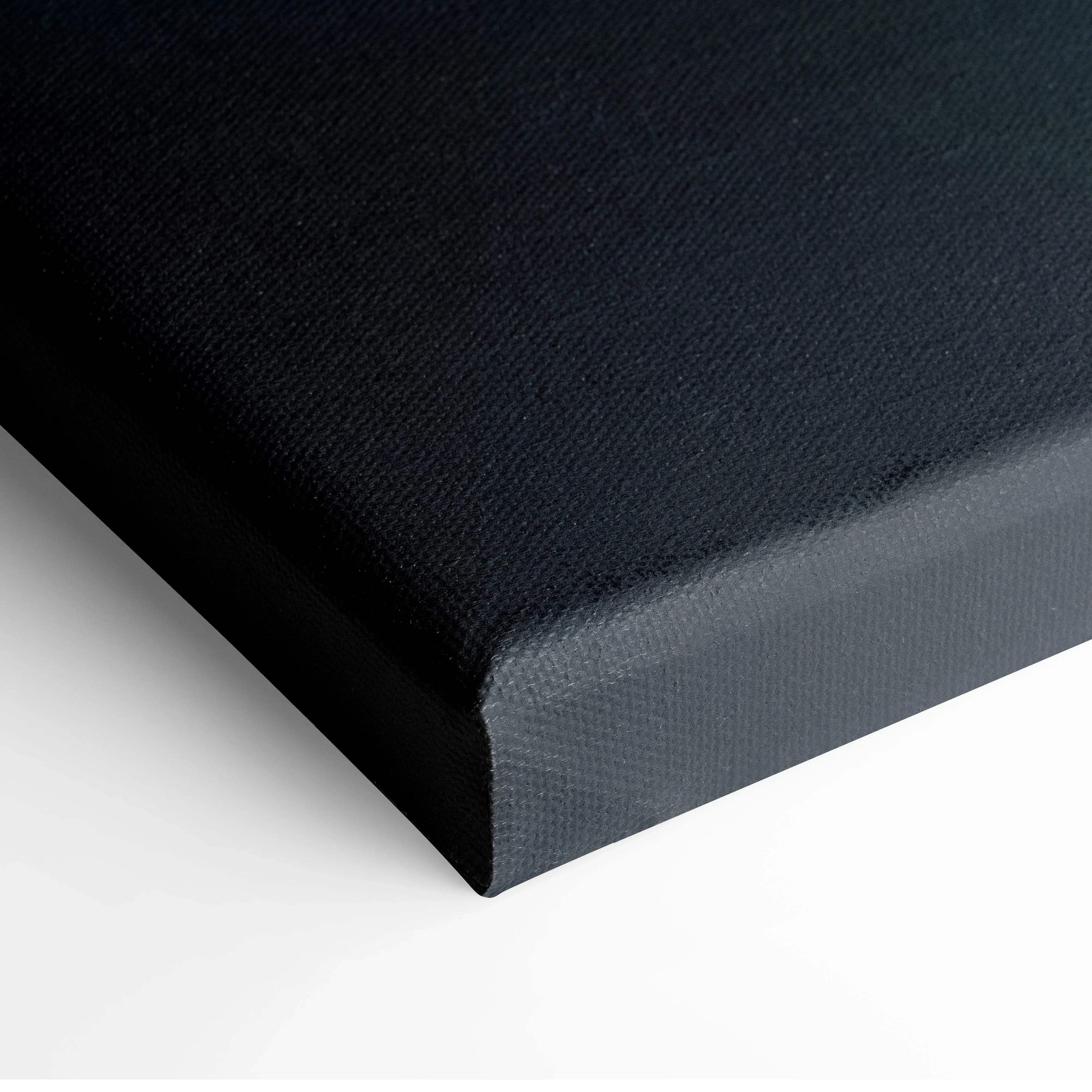 Close-up of black stretched canvas edge for wall art with durable texture.