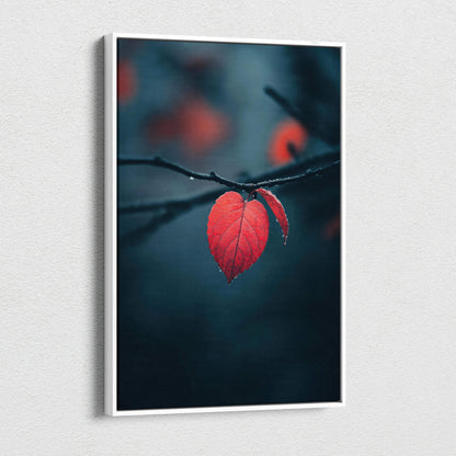 Canvas wall art featuring a close-up of a vibrant red autumn leaf on a dark blurred background.