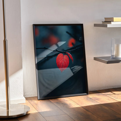 Autumn nature wall art poster featuring vibrant red fall foliage on dark blurred background in black frame.