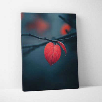 Canvas wall art featuring a close-up of a vibrant red autumn leaf on a dark blurred background.