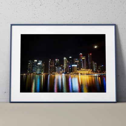 Vibrant city skyline at night with colorful reflections in water, modern wall art poster.