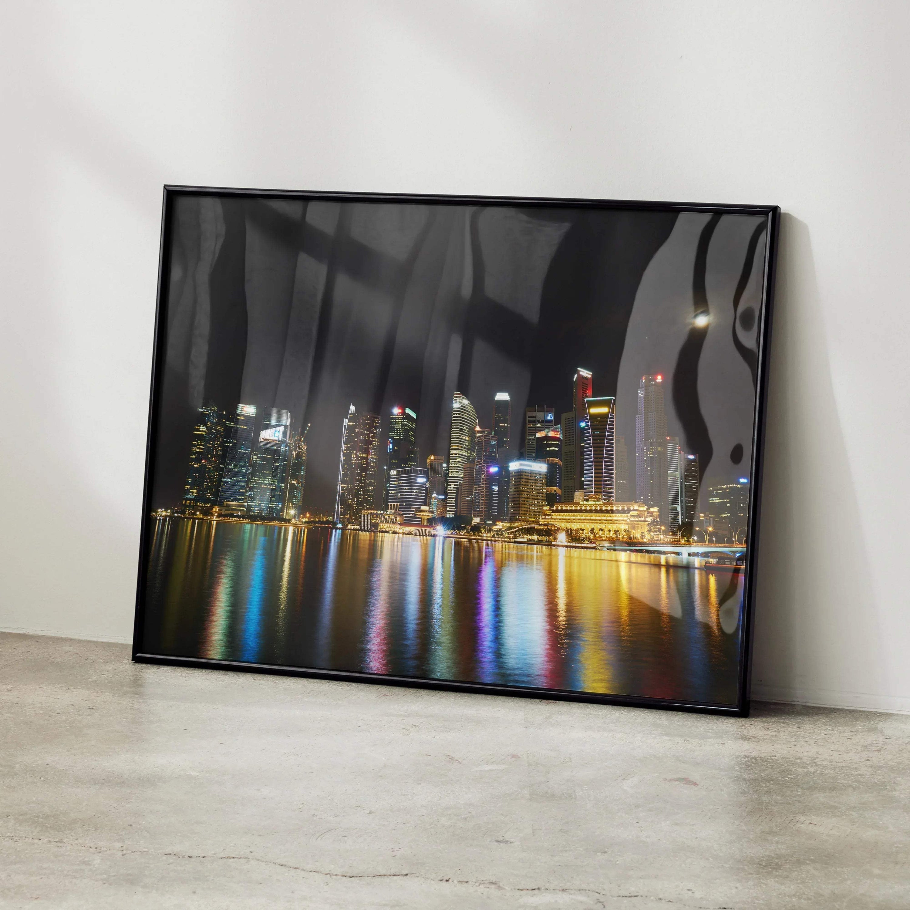 Vibrant city night skyline posters with colorful reflections in water, modern wall art in black frame.