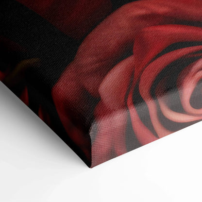 Close-up of vibrant red rose floral canvas wall art corner with detailed texture for home decor.