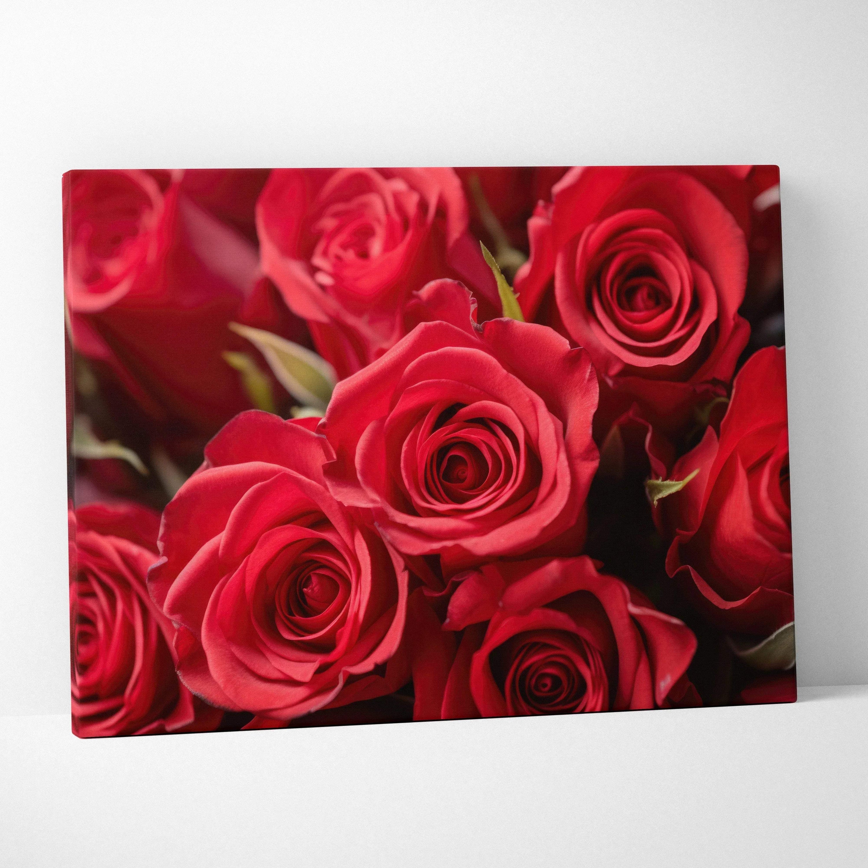 Vibrant red roses close-up on floral canvas wall art for home decor spaces.