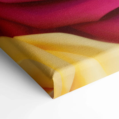 Close-up of canvas corner featuring soft pastel yellow and pink floral design on fabric texture wall art.