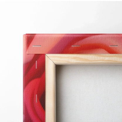 Close-up of wooden-framed canvas wall art with red and pink rose petals decor.