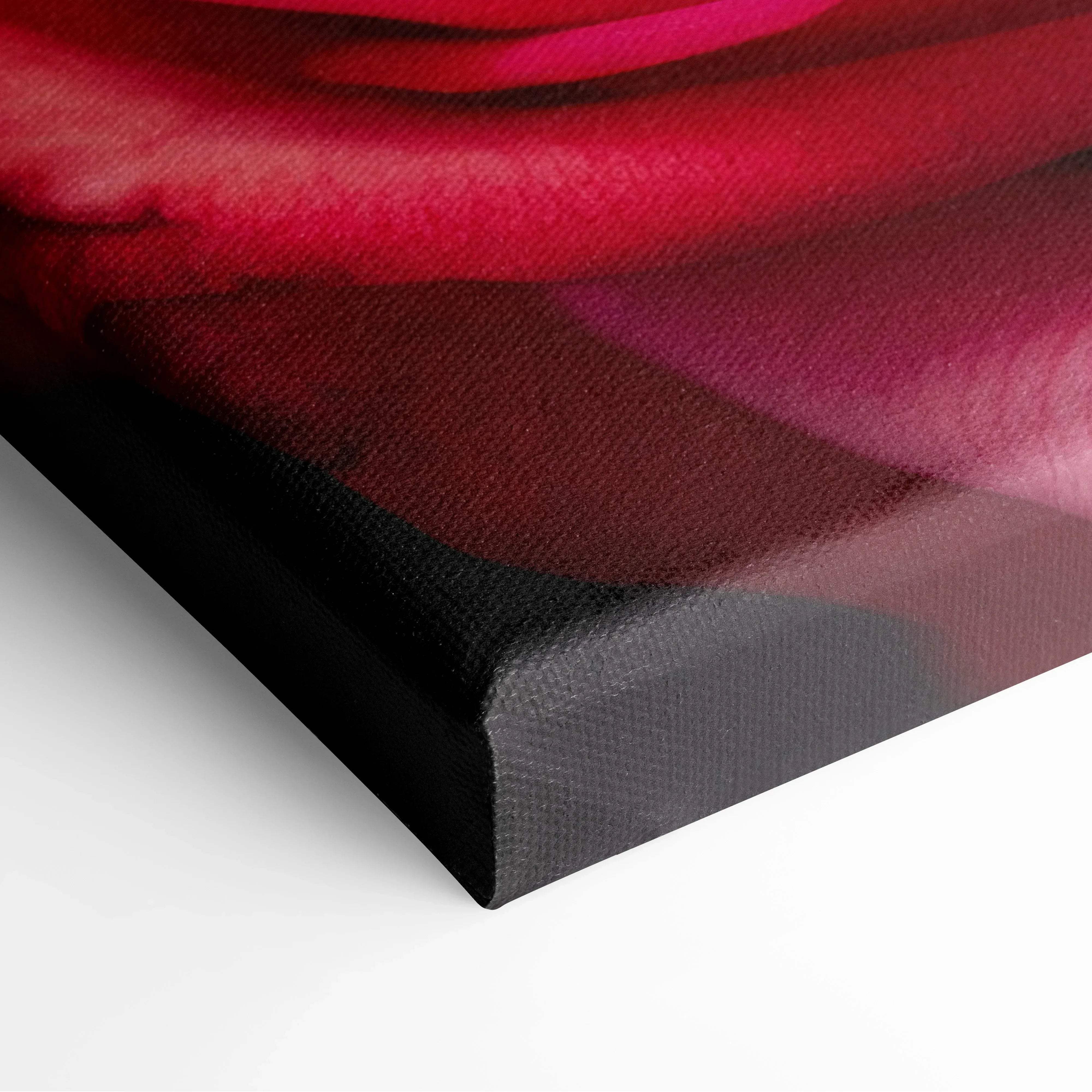A vibrant red rose printed on stretched canvas with fabric texture and black gallery-wrapped edges for living room decor