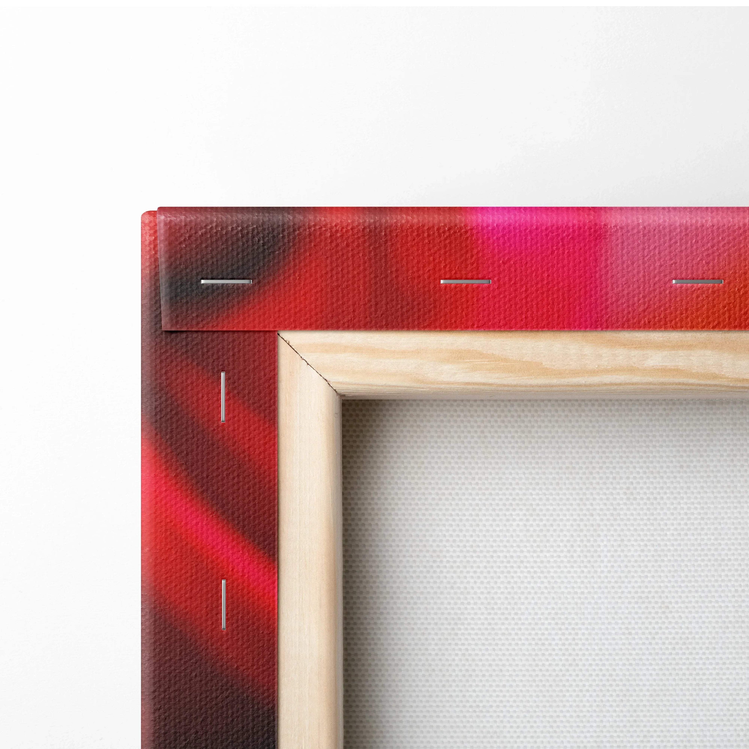 Close-up of wooden frame corner with vibrant red floral canvas wall art decor showing canvas texture and staples.