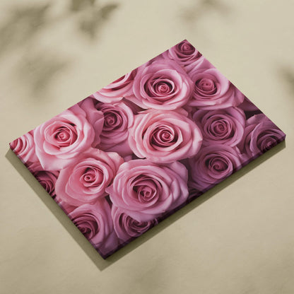 Canvas wall art featuring close-up vibrant pink roses with detailed petals and soft shading.