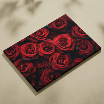 Canvas wall art featuring vibrant red roses with detailed petals on a black background for elegant floral decor.